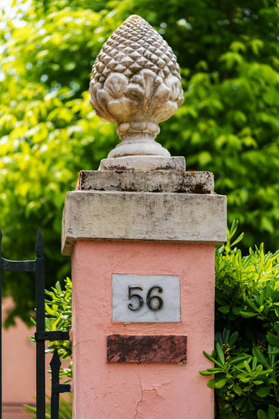 istock pink pillar with decorative finial and house number 2153593947