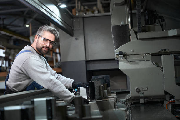 istock Smiling man working with aluminum profile in production workshop 2153595840