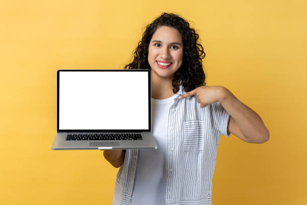 istock Woman holding and pointing laptop with empty display, copy space for advertisement. 2153597619