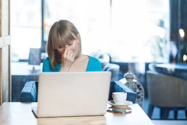istock Sad despair woman orking on laptop, crying, hiding her face, having problems with her work. 2153597655