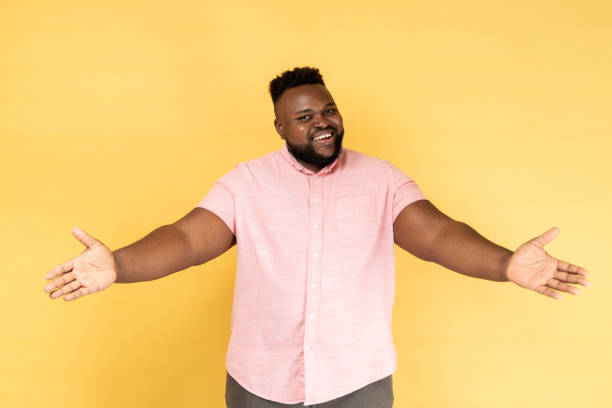 istock Man standing with raised hands and looking at camera, welcoming or giving smth. 2153598993