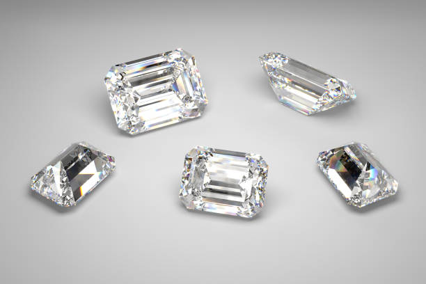Scattering of diamonds of different sizes on the white background. Emerald cut. 3d rendering. stock photo