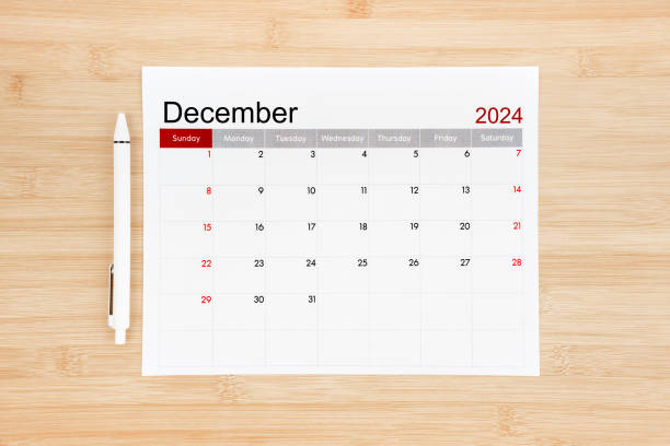 December 2024 calendar page on wooden.