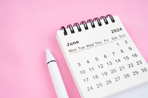 istock June 2024 month calendar on pink fabric background. 2153608529