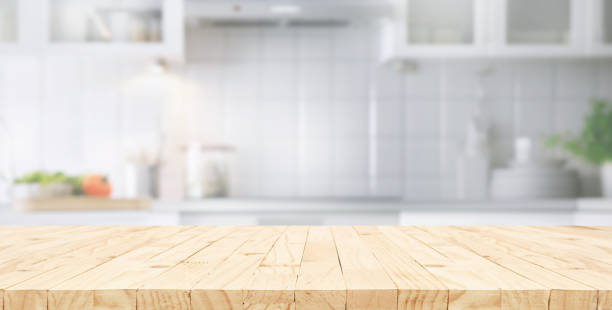istock Selective focus.End grain wood counter,table top on blur kitchen counter in morning background.For montage product display o 2153609478