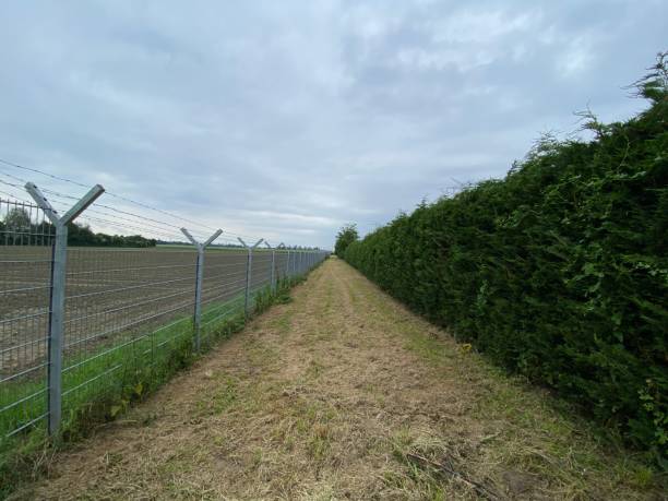istock Border patrol with barbed wire fence 2153618784