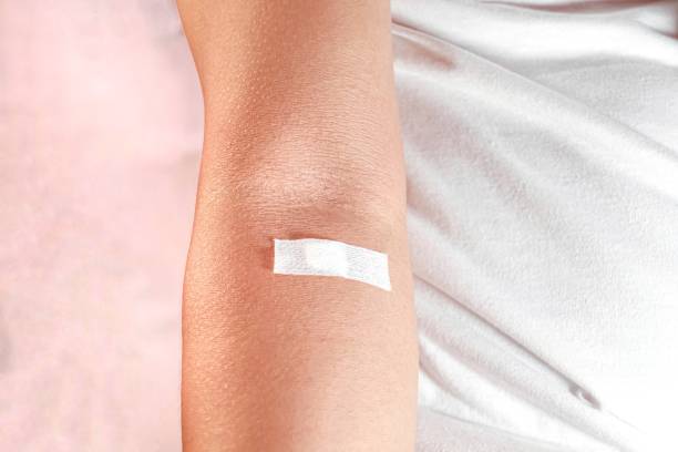 istock concept of blood donor, showing injection marks 2153619489