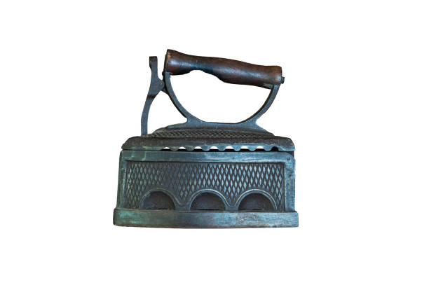 An antique iron for ironing clothes, heated with hot coals. Isolated on a white background.