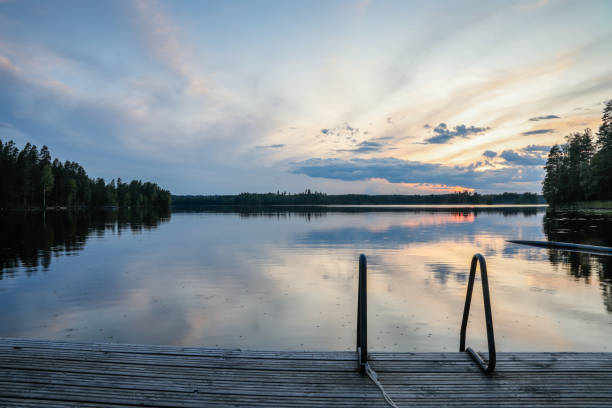 istock Finland lake nature beautiful sunset night view 2153623637