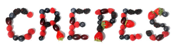 istock word CREPES isolated letter from raspberry, blackberry, strawberry with green leaf, blueberries, grape, berry crepes 2153624700