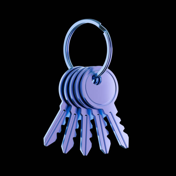 a bunch of door keys with a magnetic security key and an orange epoxy wooden keychain on a white background top view