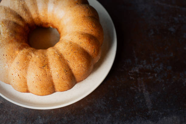 homemade chocolate banana bread bundt cake on rusty table.