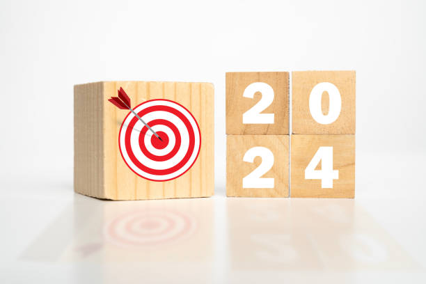 istock 2024 Year wooden cubes with dart and target icon. Goal, Target, Resolution, strategy. 2153632780