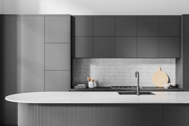 istock Gray island in white and gray kitchen interior 2153633314