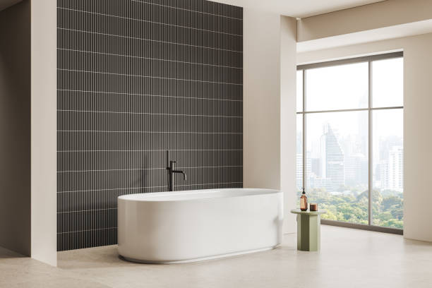 istock Stylish hotel bathroom interior with tub, accessories and panoramic window 2153633856