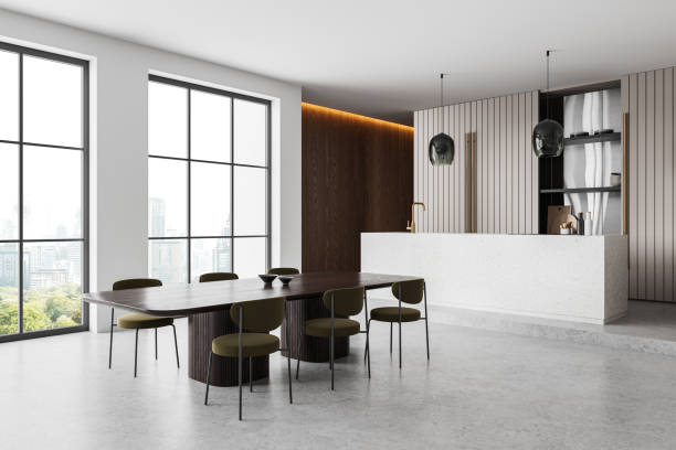 istock Stylish home kitchen interior with eating table and bar island, panoramic window 2153634108