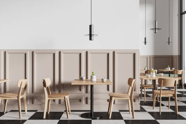 istock Stylish modern cafe interior with chairs and tables in row, panoramic window 2153634113