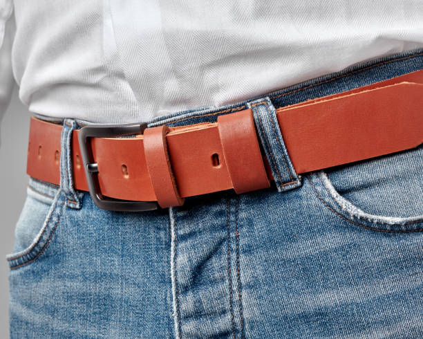 istock Man in casual attire with custom embossed terracotta leather belt 2153634319