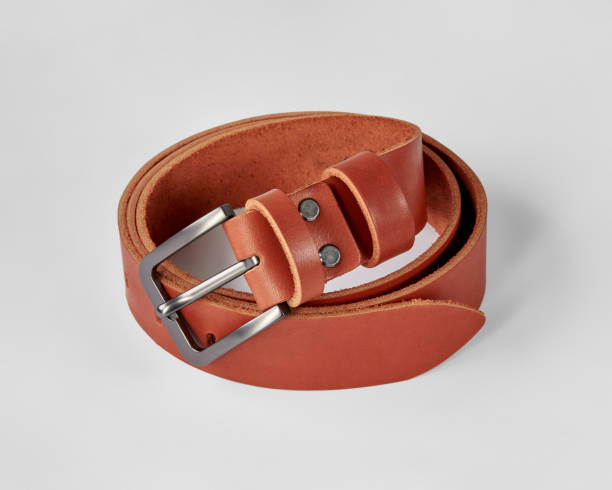 istock Folded copper leather belt with DAD embossing and engraved quote 2153634362