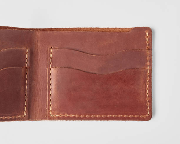 istock Open brown leather wallet with card pockets and hidden embossed message 2153634382