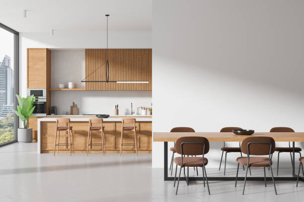 istock Modern kitchen interior with dining area on a cityscape background, showcasing wooden furniture and minimalist design, concept of urban home. 3D Rendering 2153635295