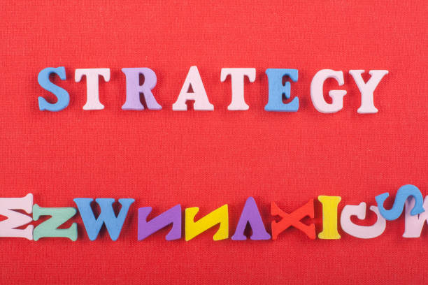 Word on red background composed from colorful abc alphabet block wooden letters, copy space for ad text. Learning english concept
