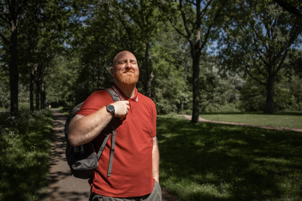 Handsome redhead bearded mature man enjoying the outdoors peacefully despite suffering from allergies in the spring