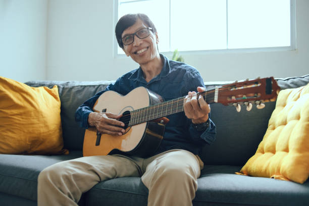 istock Senior Man Playing Music At Home 2153642076