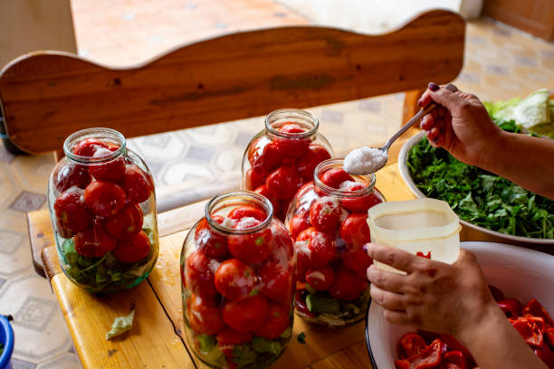 istock A woman is preparing food in a kitchen 2153643114