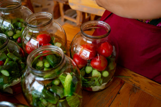 istock A woman is preparing a salad in a glass jar 2153644022
