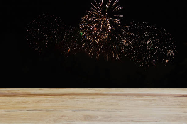 istock A blank wooden table top with a fireworks background makes the night sky glow with bright colors. The atmosphere is festive and celebratory. creative interior ideas 2153645139