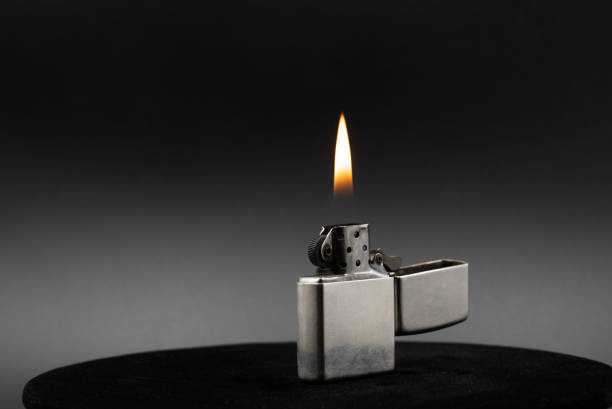 istock Metal lighter and its flame shot on a black background 2153646376