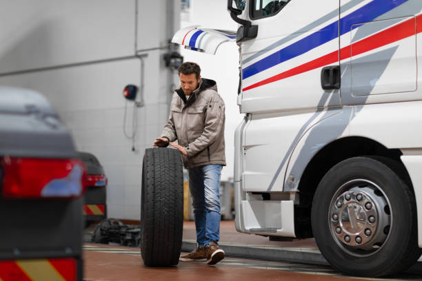 istock Truck mechanic changing tire 2153649331