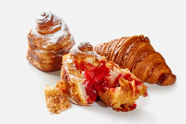istock Flaky croissant and cube shaped cruffins with berry filling 2153649983