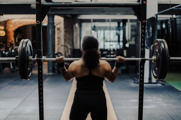 istock Young Woman Athlete Weightlifting Training Session 2153650457