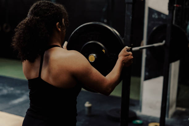 istock Young Woman Athlete Weightlifting Training Session 2153650465