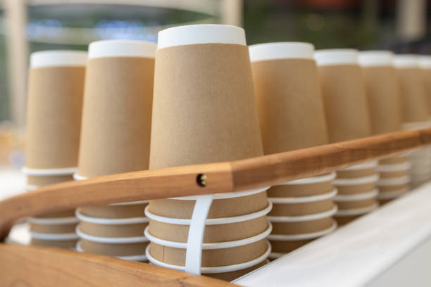 istock A wooden tray with many brown paper cups on it 2153651749