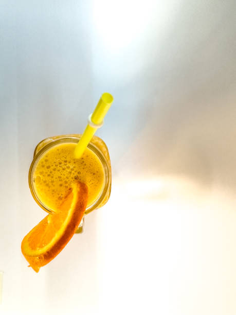 istock solitary orange juice on a white background 2153651870