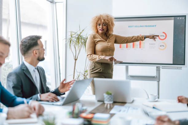 istock Woman presenting data to colleagues 2153656552