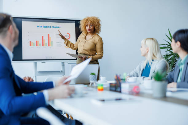 istock Businesswoman presenting data to colleagues 2153656564