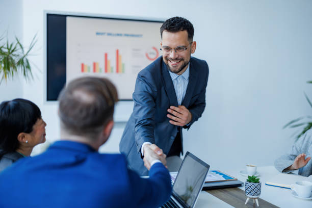 istock Business handshake at meeting 2153656847