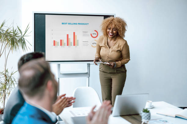 istock Smiling woman presenting business chart 2153656956