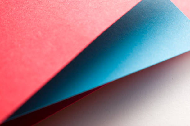 Multicoloured paper sticky notes on blue background