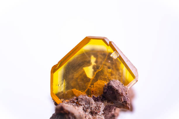 yellow, orange wulfenite. From USA. macro photography detail texture background. close-up raw rough unpolished semi-precious gemstone