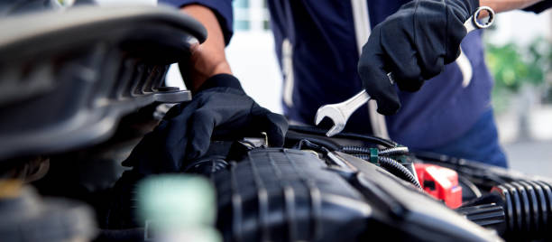 istock Professional mechanic working on the engine , repairing a car engine automotive workshop with a wrench, car service and maintenance,Repair service. 2153661036