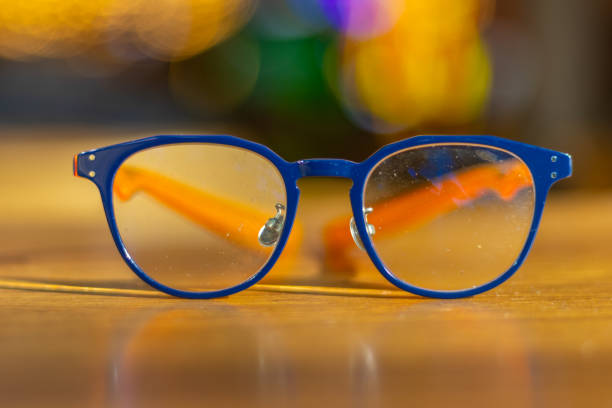 istock Blue frame glasses on a brown table in a Sydney Restaurant with colourful Bokeh Blurred Background NSW Australia 2153662989