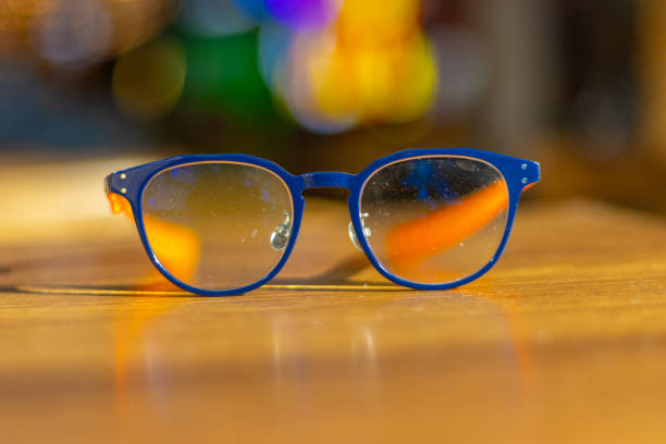 istock Blue frame glasses on a brown table in a Sydney Restaurant with colourful Bokeh Blurred Background NSW Australia 2153662994