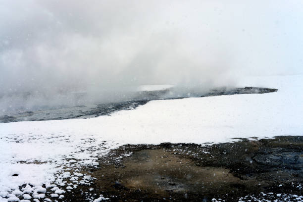 Geothermal pool in winter Yellowstone National Park steaming