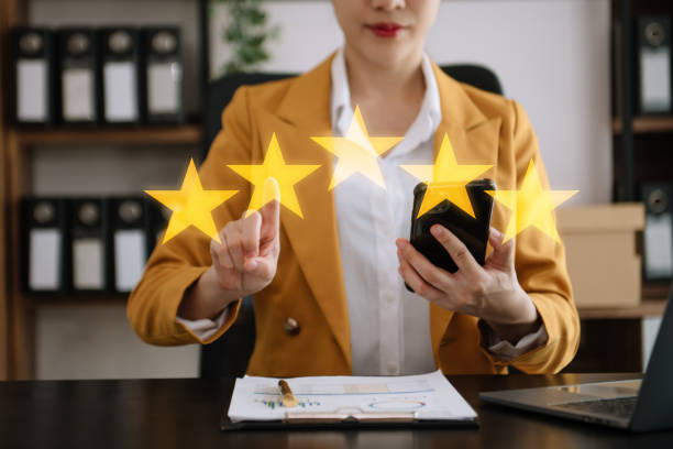 istock Customer or client the stars to complete five stars. with copy space. giving a five star rating. Service rating, satisfaction concept. 2153666018