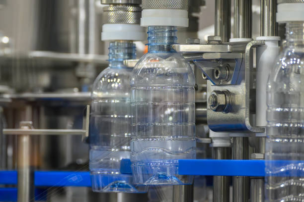 istock The  empty drinking water bottles  on the conveyor belt for filling process. 2153666857